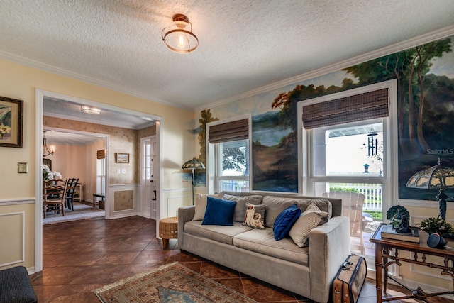 living room featuring dark tile patterned floors, a textured ceiling, and ornamental molding