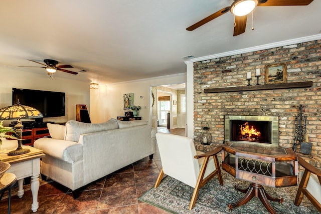 living room with a brick fireplace, dark tile patterned floors, and ornamental molding