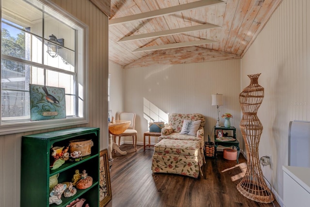 sitting room with a healthy amount of sunlight, vaulted ceiling with beams, dark wood-type flooring, and wooden ceiling