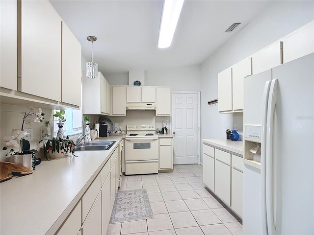 kitchen with white cabinetry, sink, hanging light fixtures, and white appliances