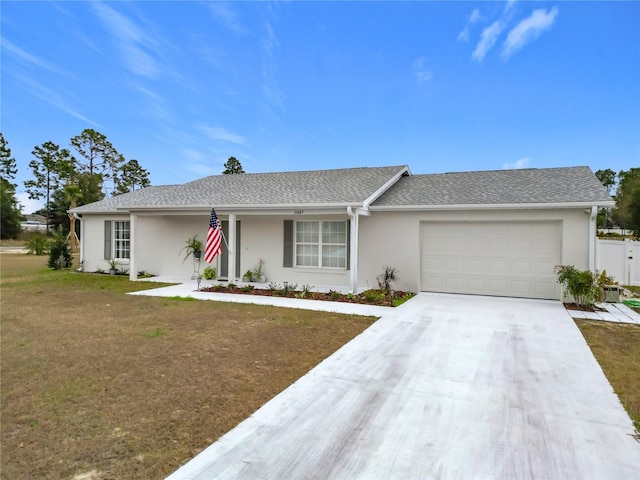 ranch-style home with a front yard and a garage