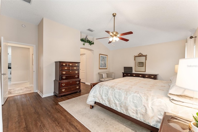 bedroom featuring vaulted ceiling, ceiling fan, and dark hardwood / wood-style flooring