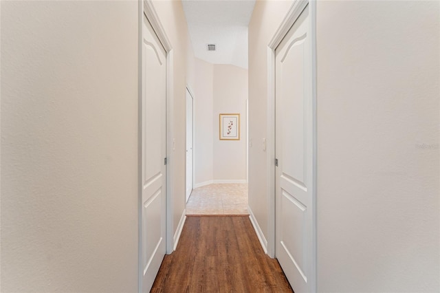 hallway featuring dark hardwood / wood-style floors