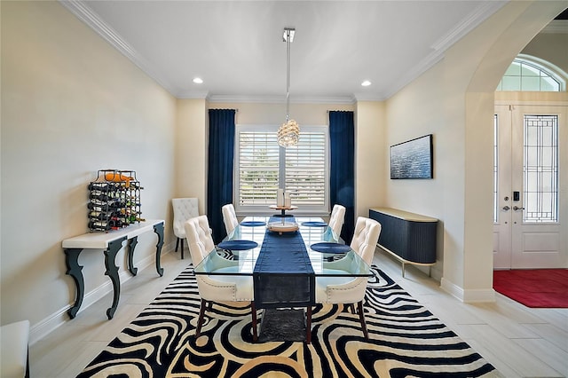 dining space with a chandelier and ornamental molding