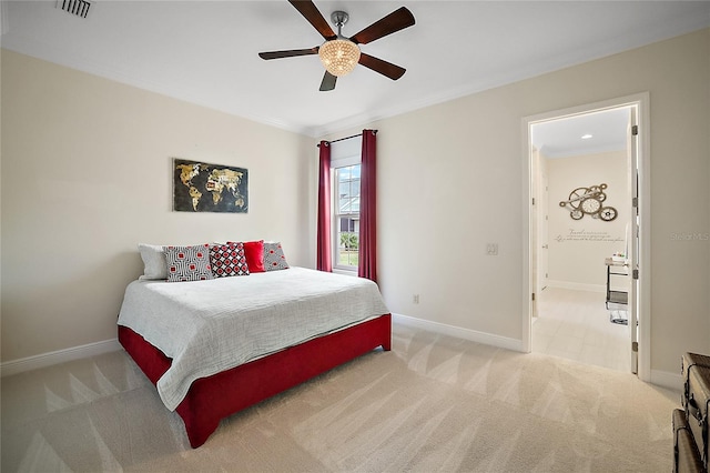 bedroom featuring ceiling fan, light colored carpet, and ornamental molding