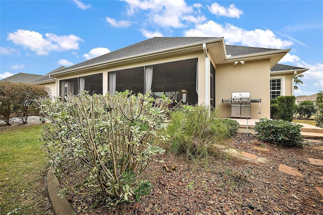 view of home's exterior featuring a sunroom