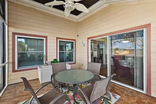 view of patio with a ceiling fan and outdoor dining space