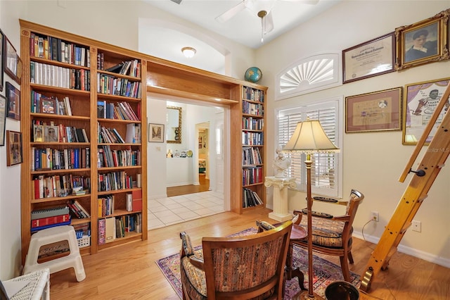 office featuring ceiling fan, baseboards, and wood finished floors