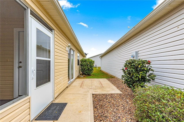 view of side of home featuring a patio