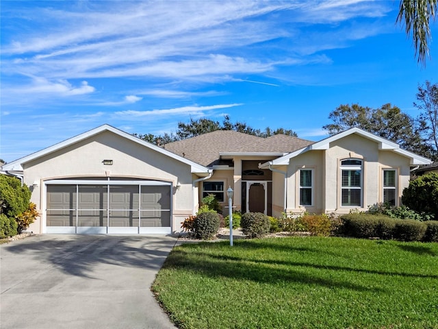 ranch-style home with a front yard and a garage