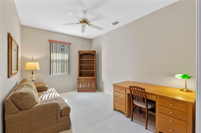 carpeted home office with ceiling fan