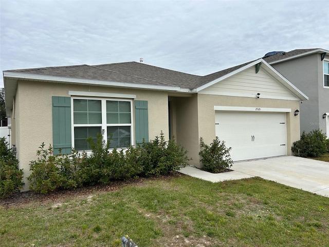 ranch-style home featuring a front lawn and a garage