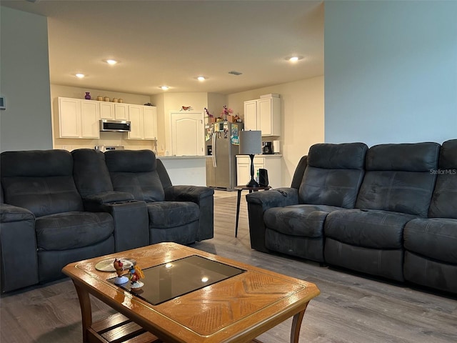 living room with light hardwood / wood-style flooring