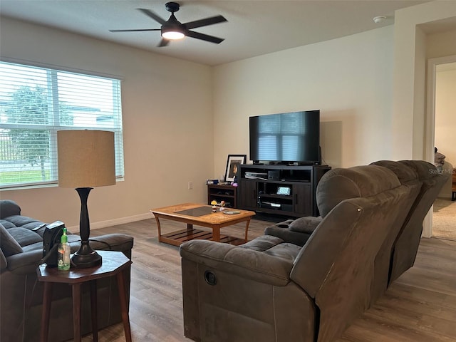 living room with hardwood / wood-style floors and ceiling fan