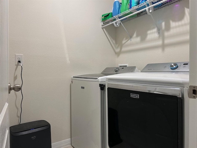 washroom featuring separate washer and dryer