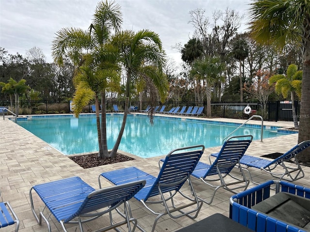 view of swimming pool with a patio