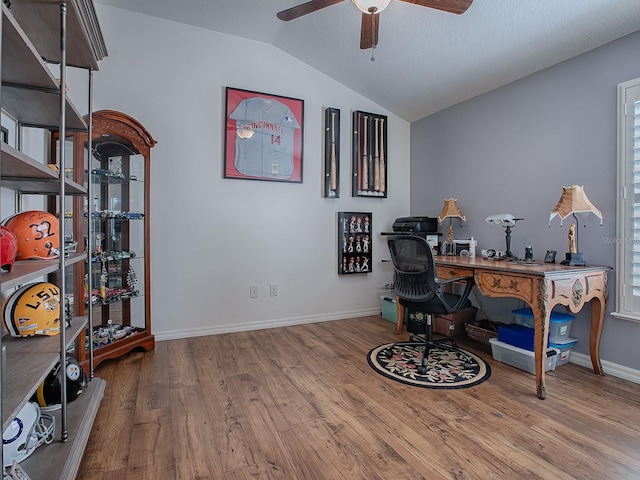 office featuring lofted ceiling, hardwood / wood-style floors, and ceiling fan