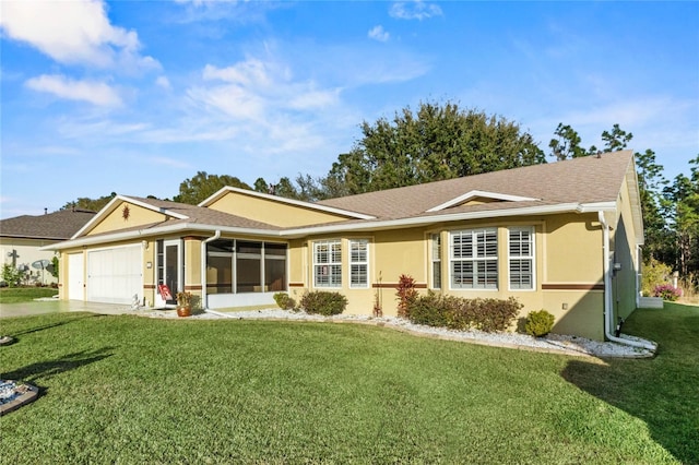 ranch-style house with a garage, a sunroom, and a front lawn