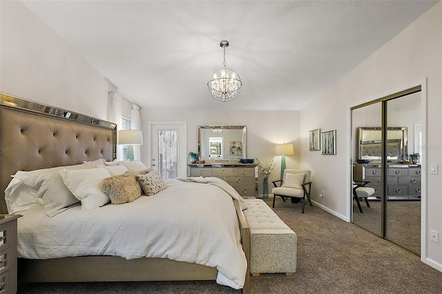 carpeted bedroom with a chandelier