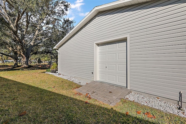 garage featuring a yard