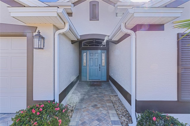 property entrance with a garage