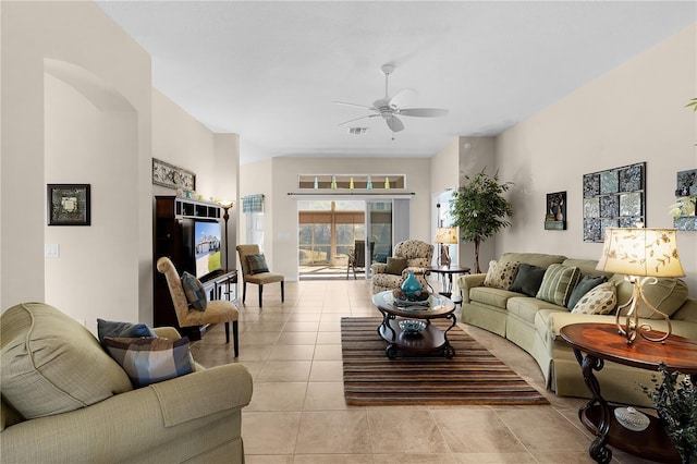 living room with ceiling fan and light tile patterned floors