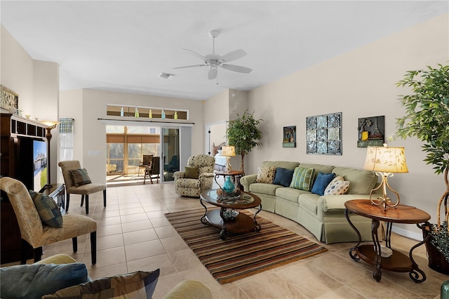 living room with ceiling fan and light tile patterned floors