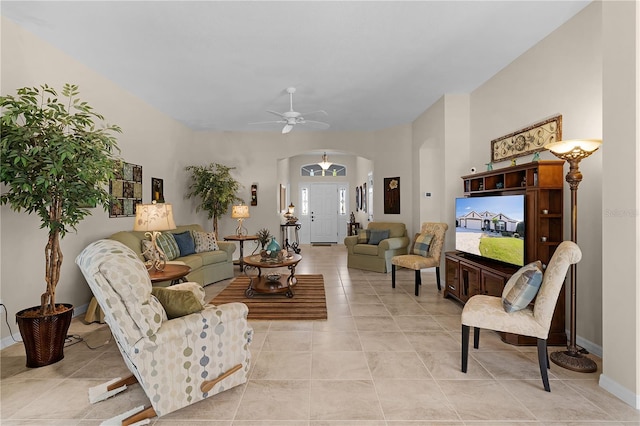 tiled living room featuring ceiling fan