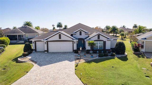 view of front of house with a garage and a front lawn