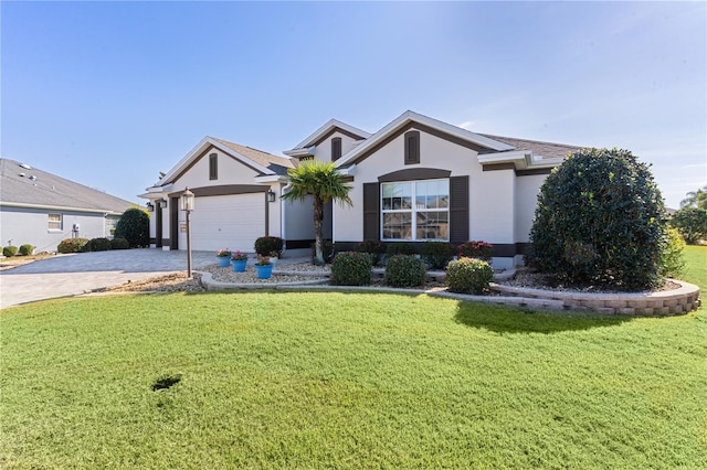 single story home with a front yard and a garage