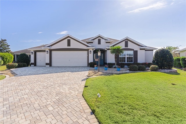 ranch-style home with a front yard and a garage