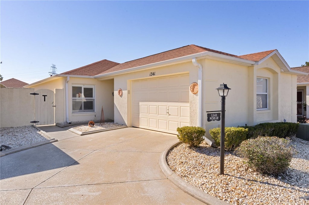 ranch-style home with a garage