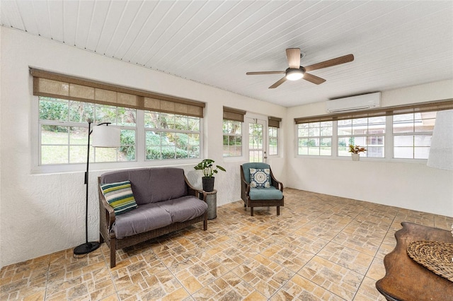 sunroom / solarium with ceiling fan and a wall mounted AC