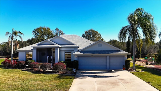 ranch-style house with a garage and a front lawn