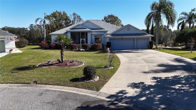 ranch-style house featuring a front lawn and a garage