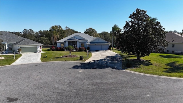 single story home with a garage and a front yard