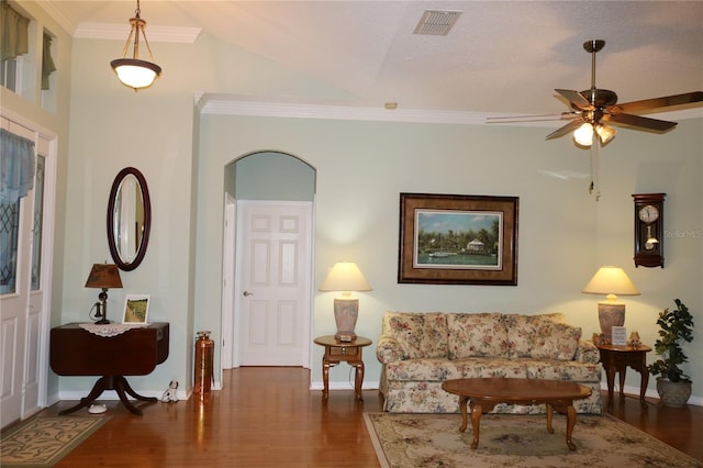 living room featuring a textured ceiling, ceiling fan, crown molding, and dark wood-type flooring