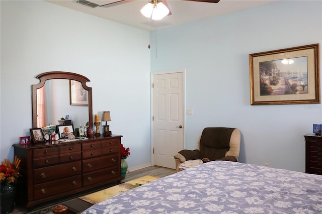 bedroom with light hardwood / wood-style flooring and ceiling fan