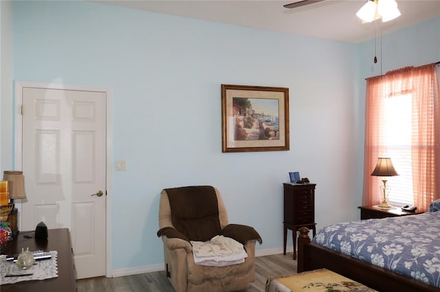 bedroom featuring light hardwood / wood-style floors and ceiling fan