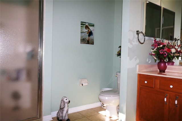 bathroom with vanity, an enclosed shower, and toilet