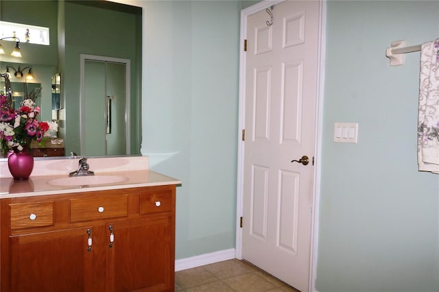 bathroom with tile patterned flooring and vanity