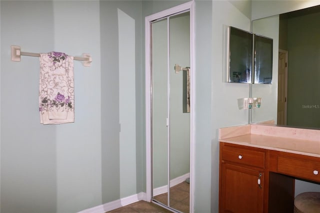 bathroom with tile patterned flooring and vanity