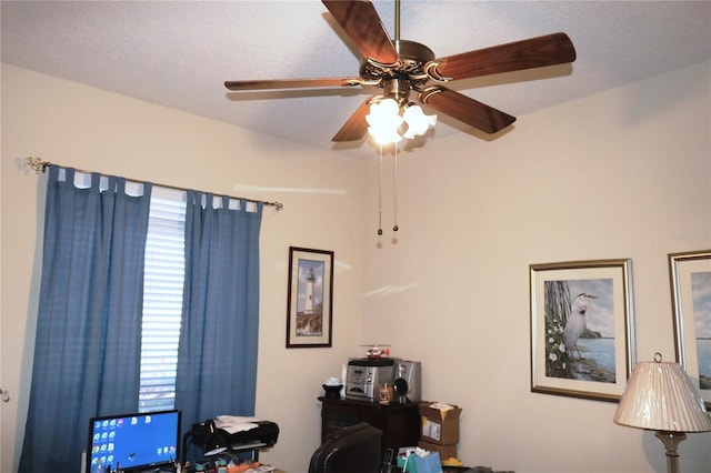 office area with a textured ceiling and ceiling fan