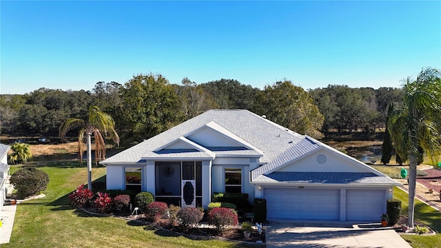 view of front of house with a front yard and a garage