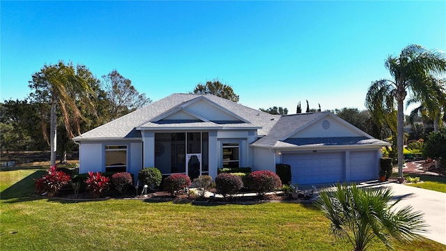 single story home featuring driveway, an attached garage, a front lawn, and stucco siding