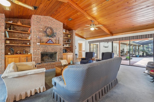 carpeted living room featuring lofted ceiling with beams, a healthy amount of sunlight, wooden ceiling, and a fireplace