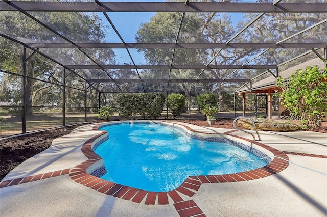 view of swimming pool with a patio and a lanai