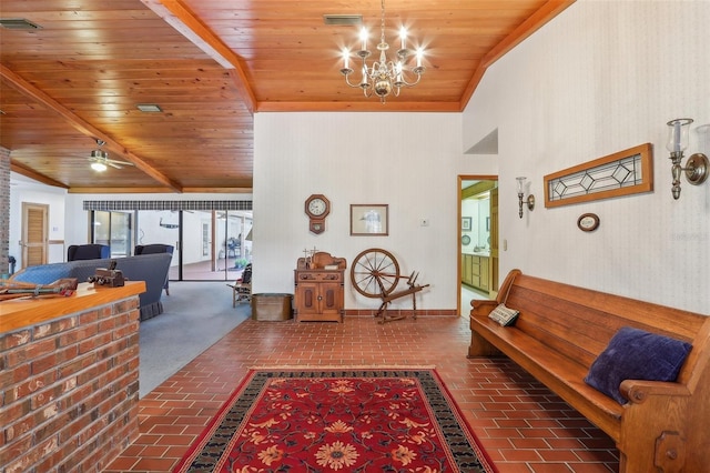 interior space featuring vaulted ceiling with beams, wood ceiling, and ceiling fan with notable chandelier