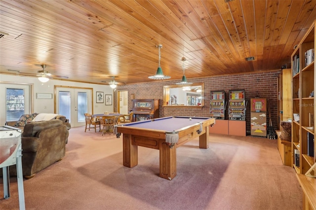 game room featuring french doors, light colored carpet, pool table, and brick wall