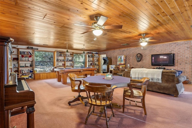 dining room with carpet, indoor bar, wooden ceiling, and brick wall